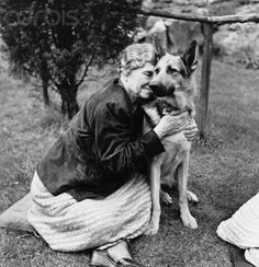 Black and white photograph of woman and dog